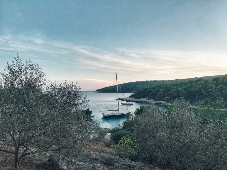 a harbor and beach in Korcula Croatia, beach hopping is one of the most popular activities in Korcula