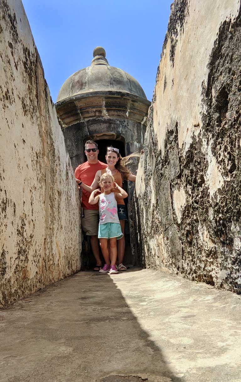 family in a narrow walkway in Puerto Rico