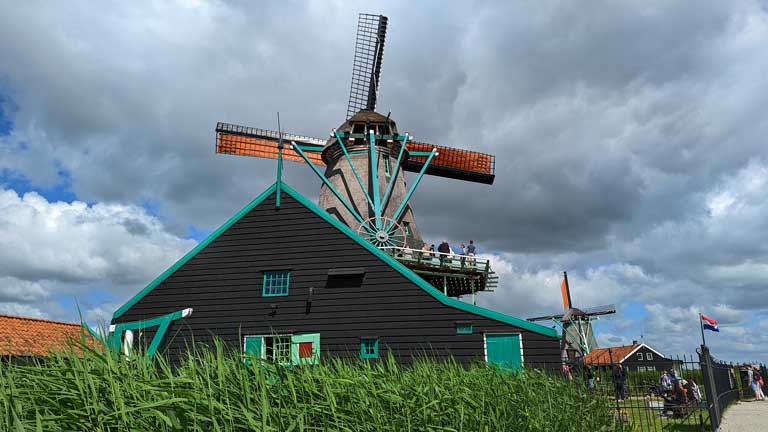 Looking up at a windmill in Zaanse Schans Netherlands