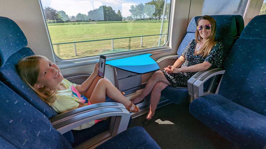 mother and daughter on a train in belgium