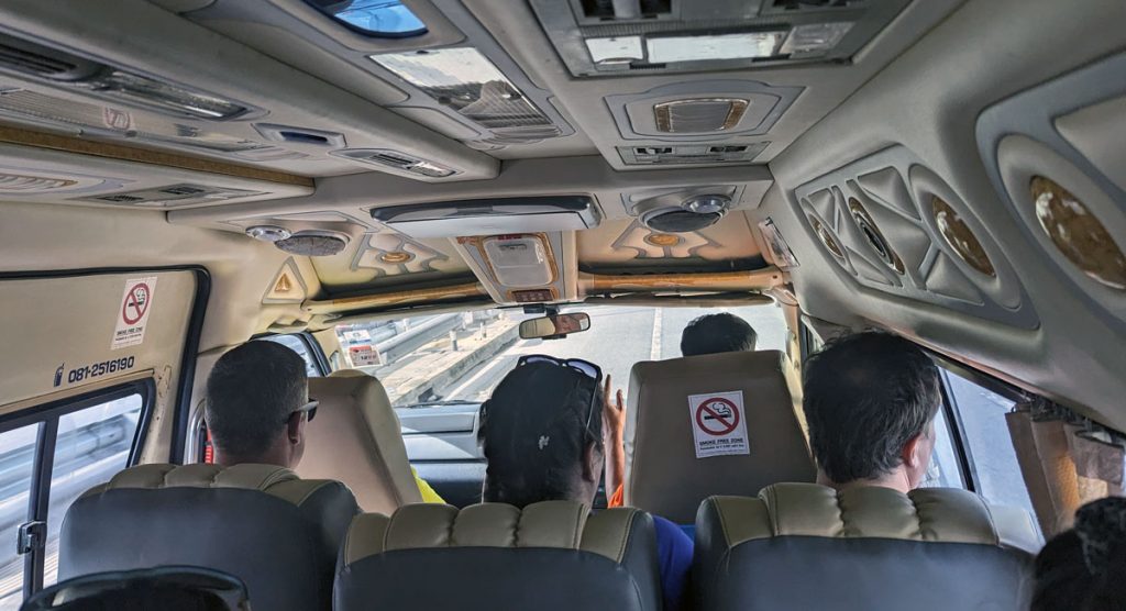 people in a van on a guided day trip from Bangkok to the floating markets 