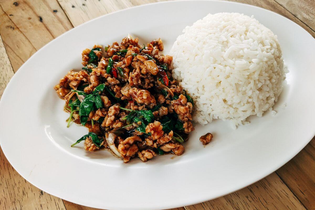Pad Krapow on a white plate with rice