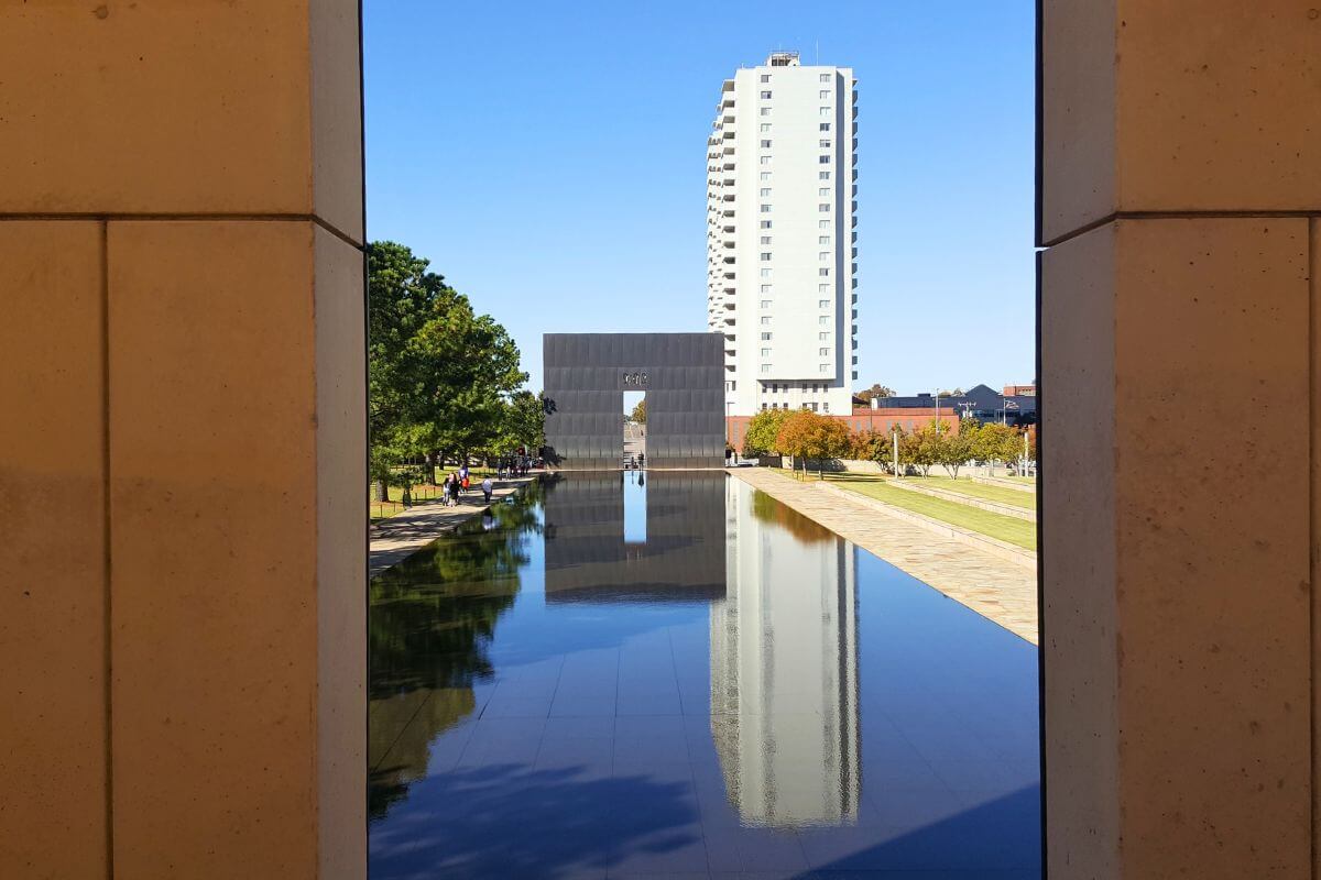 looking through one gate at the other gate and reflection pool at the Oklahoma City Memorial