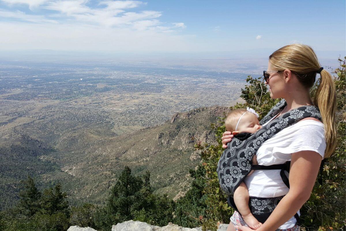 baby sleeping in a baby carrier