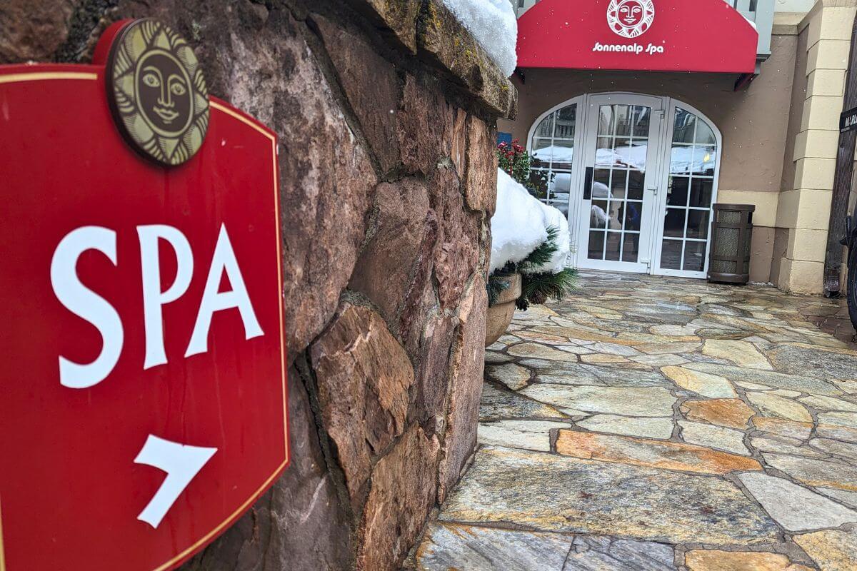 a sign pointing to a spa in Vail